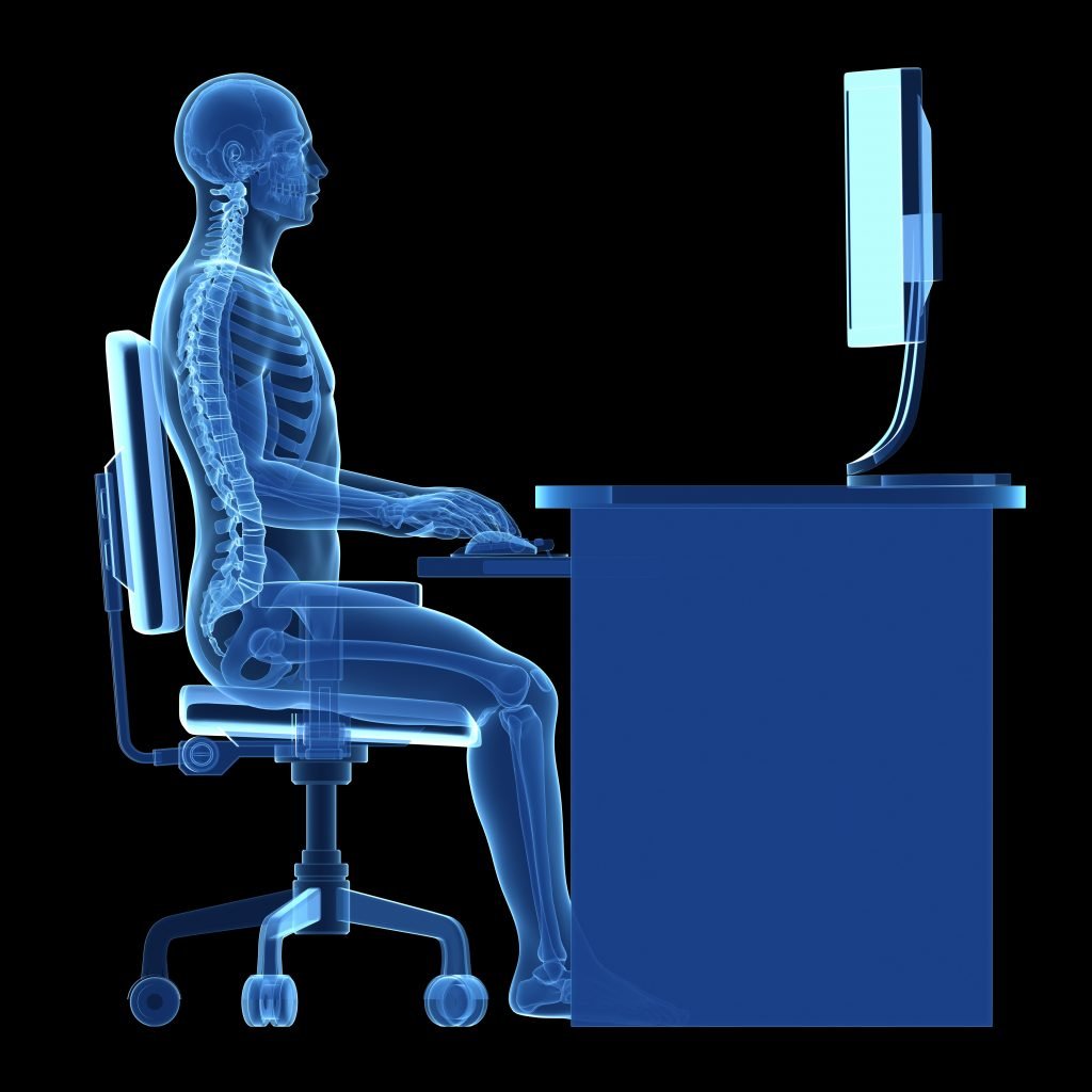 x-ray of employee at desk